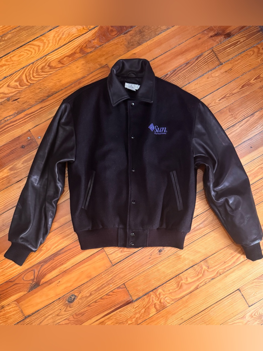 Black Varsity Jckt with Sun Microsystems Logo & Java Logo (bck).  Offers Welcome
